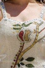 Close Up of hand-beaded dress covered in crystals